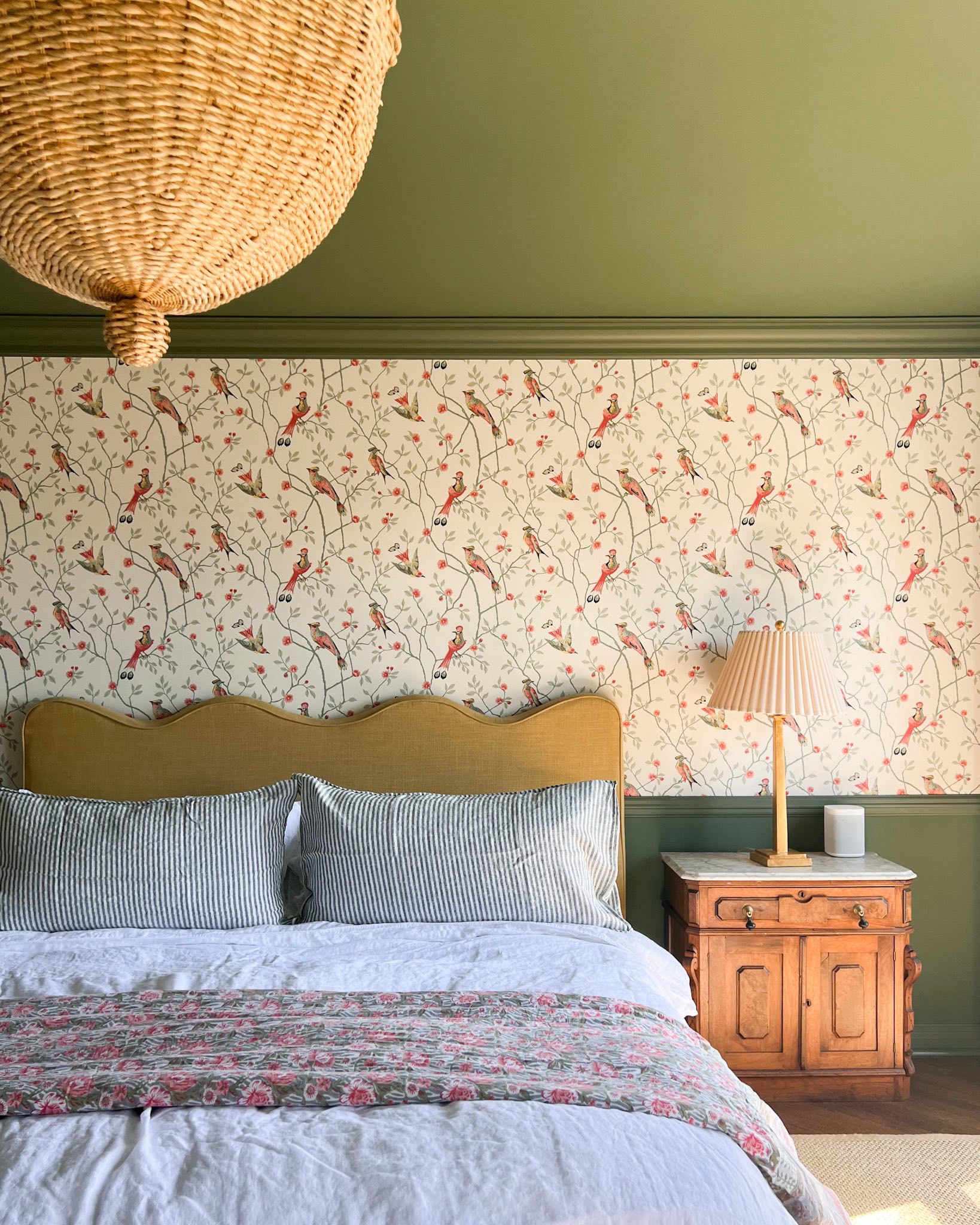 View Pattern-rich bedroom, with a bed, table lamp in view. The early morning sunshine flowing in