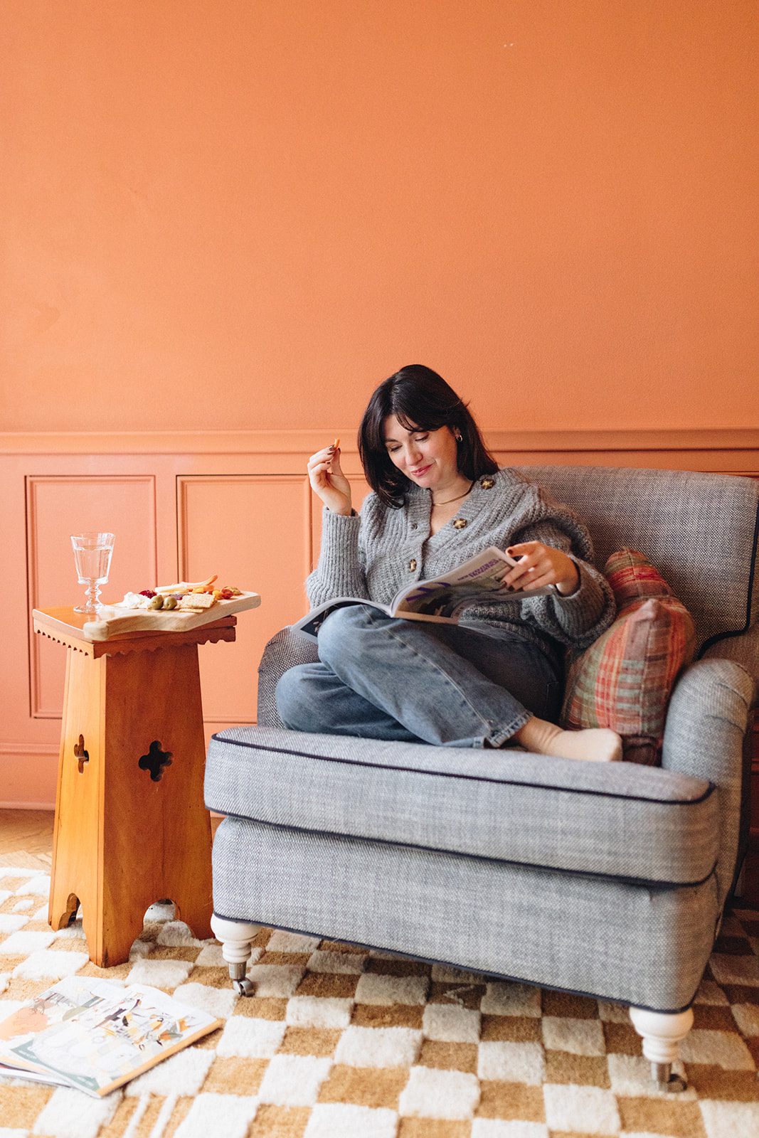 Woman sitting on a chair enjoying a snack